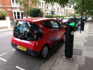 A Bluecity electric car sharing vehicle charging in London's Hammersmith and Fulham