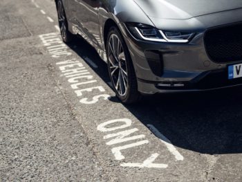 Electric Vehicles Only sign with Jaguar I-Pace